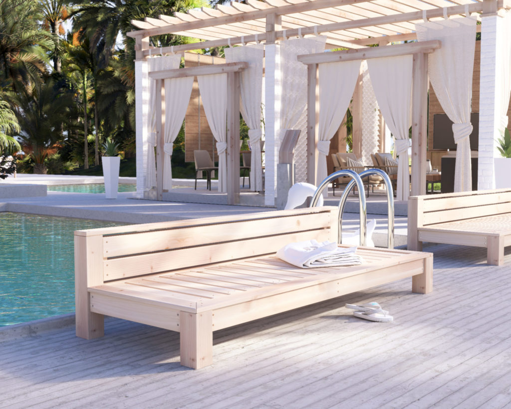 DIY wooden lounge bed by the pool in a tropical resort setting