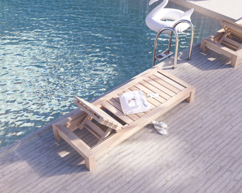 Finished wooden chaise lounge bed by the poolside, perfect for sunbathing and relaxation