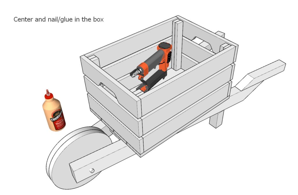 Adding the crate to the wheelbarrow