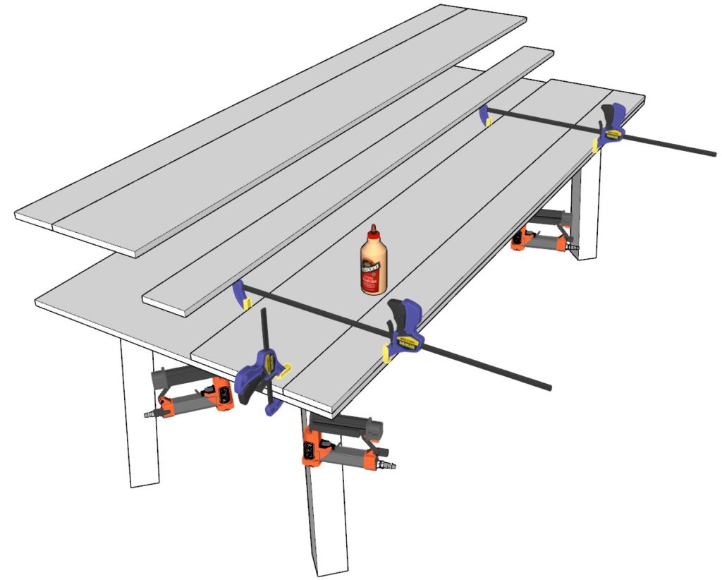 Using wood glue, nail gun, and clamps to secure all the table top pieces to the table top