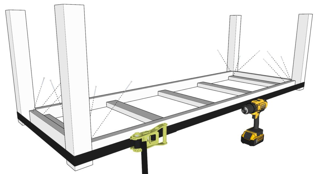 Securing the table lets to the table frame using ratchet straps and glue and screws