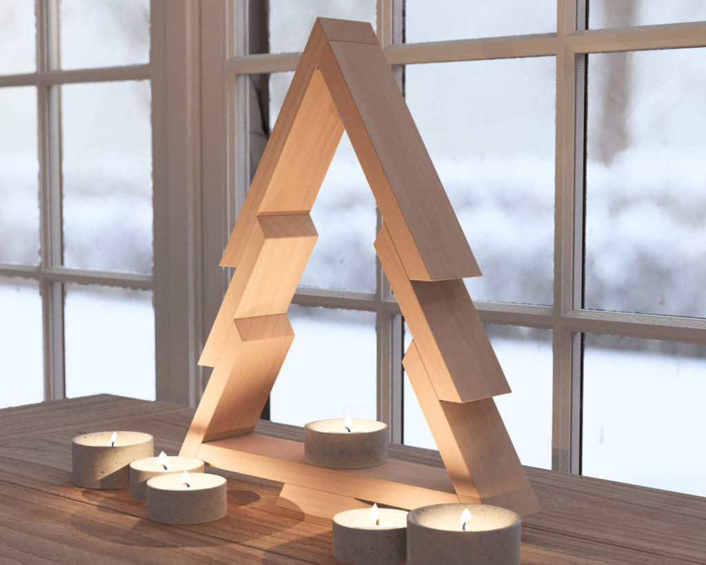 Modern wooden Christmas tree design with surrounding candles on a table by a snowy window.