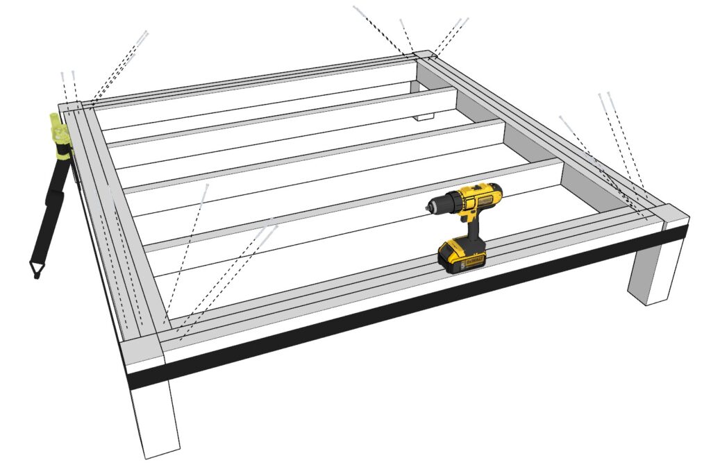 Adding screws to the table frame and securing them to the table legs