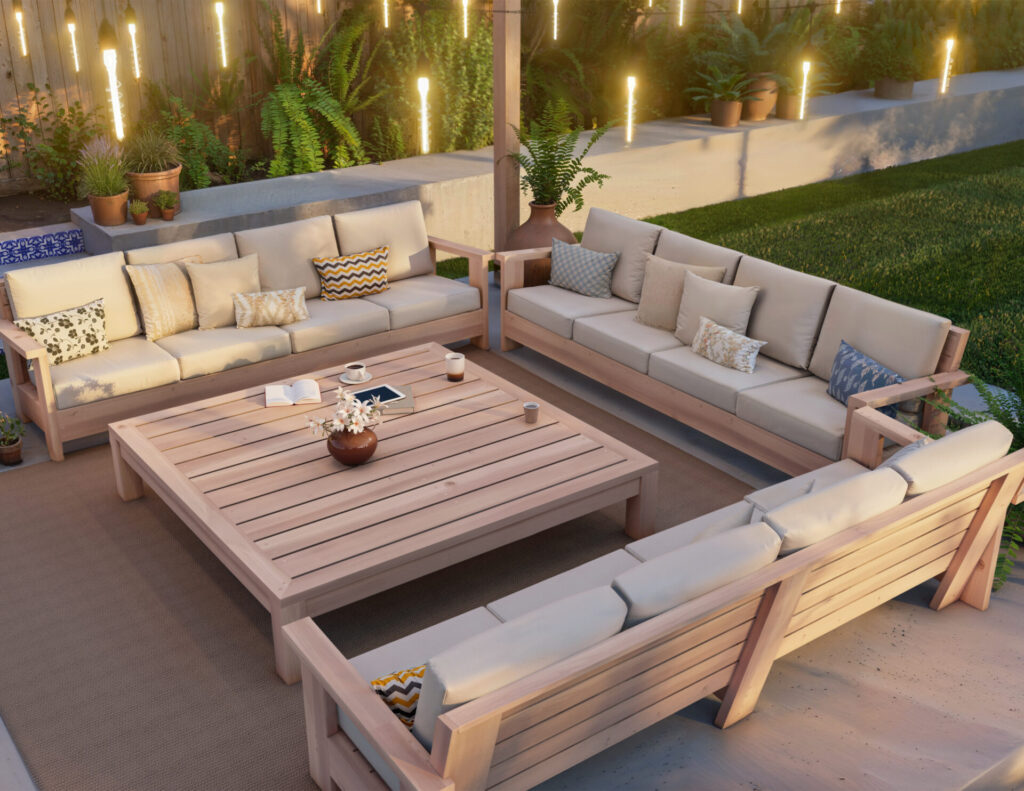 DIY wooden patio furniture set with comfortable cushions and spacious coffee table in a serene backyard setting.