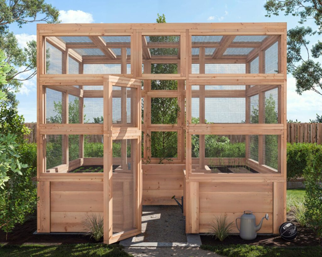 Close-up view of a newly constructed DIY wooden garden enclosure with mesh panels for pest protection.