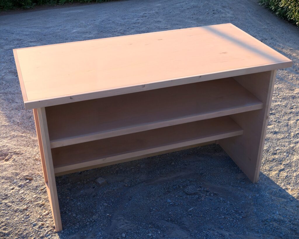 A beautifully crafted collapsible coffee bar with a wooden chevron pattern, featuring 'good vibes only' in white lettering, set up for an outdoor party with wine bottles, ice buckets, and glassware.