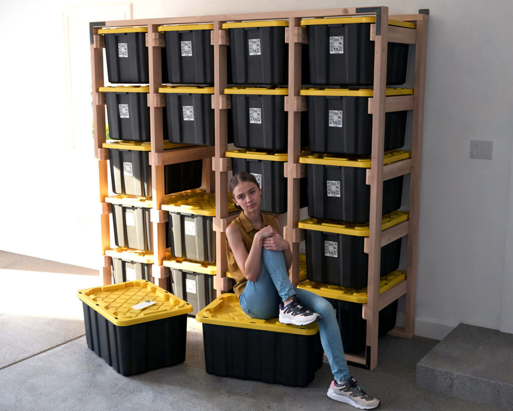 DIY 4x5 wooden storage rack for 27-gallon totes in a garage.