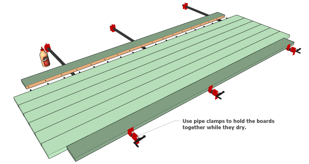 Gluing the table top boards together using dowel joint