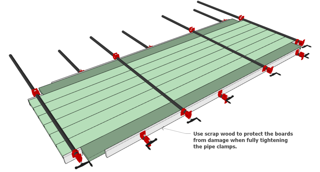 Gluing the table top boards together using dowel joint