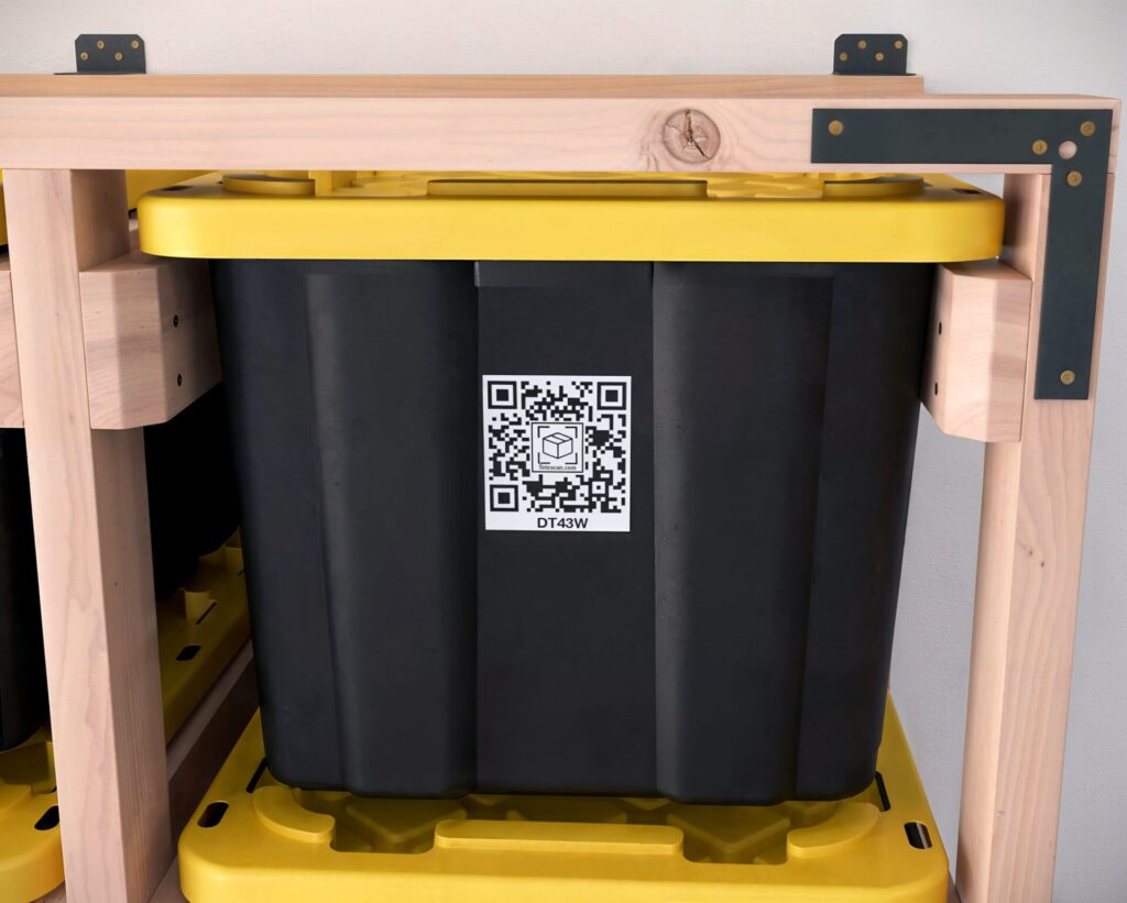 DIY 5x5 wooden storage rack for 27-gallon totes in a garage.