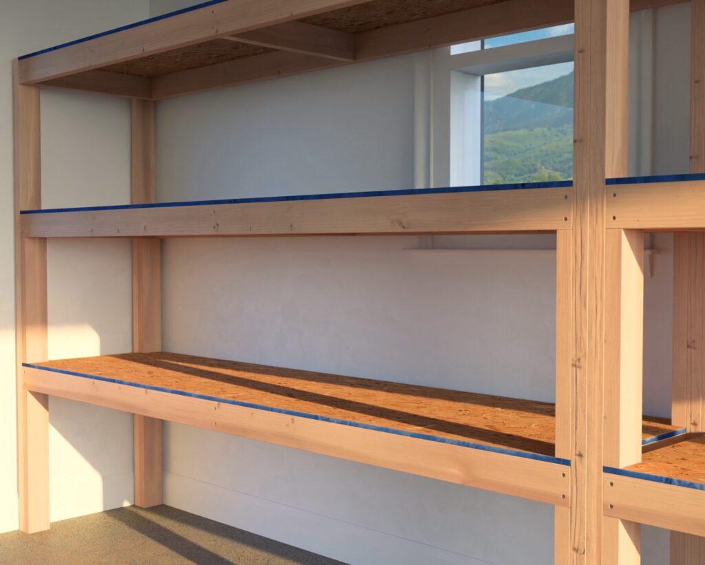 A heavy-duty DIY garage shelf made from 2x4 lumber and plywood, securely attached to the garage wall. The shelves are reinforced and spacious, designed for storing heavy items like tools, car parts, and storage bins.