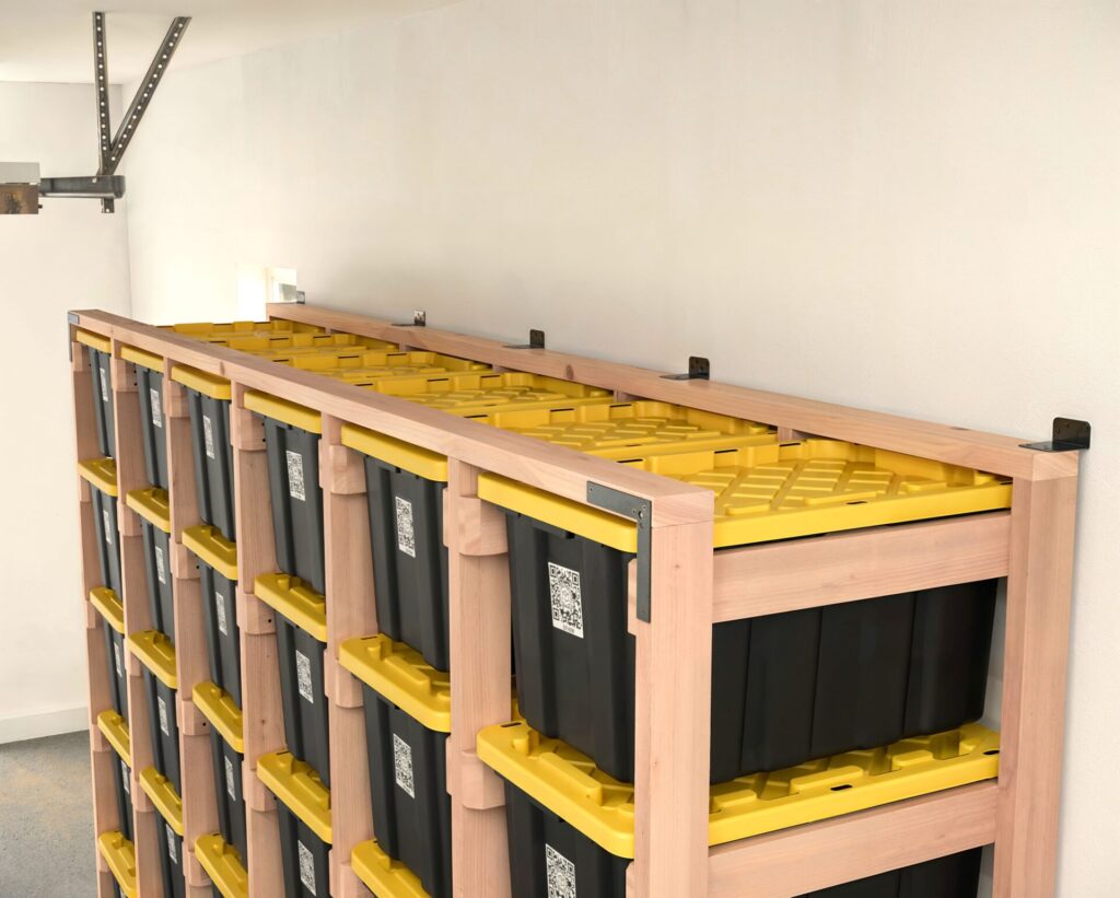 DIY 6x5 wooden storage rack for 27-gallon totes in a garage.