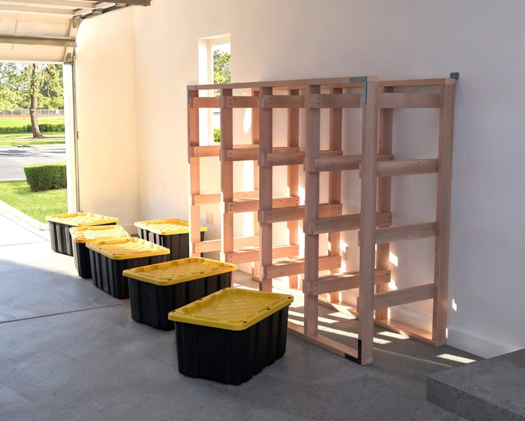 DIY 4x4 wooden storage rack for 27-gallon totes in a garage.