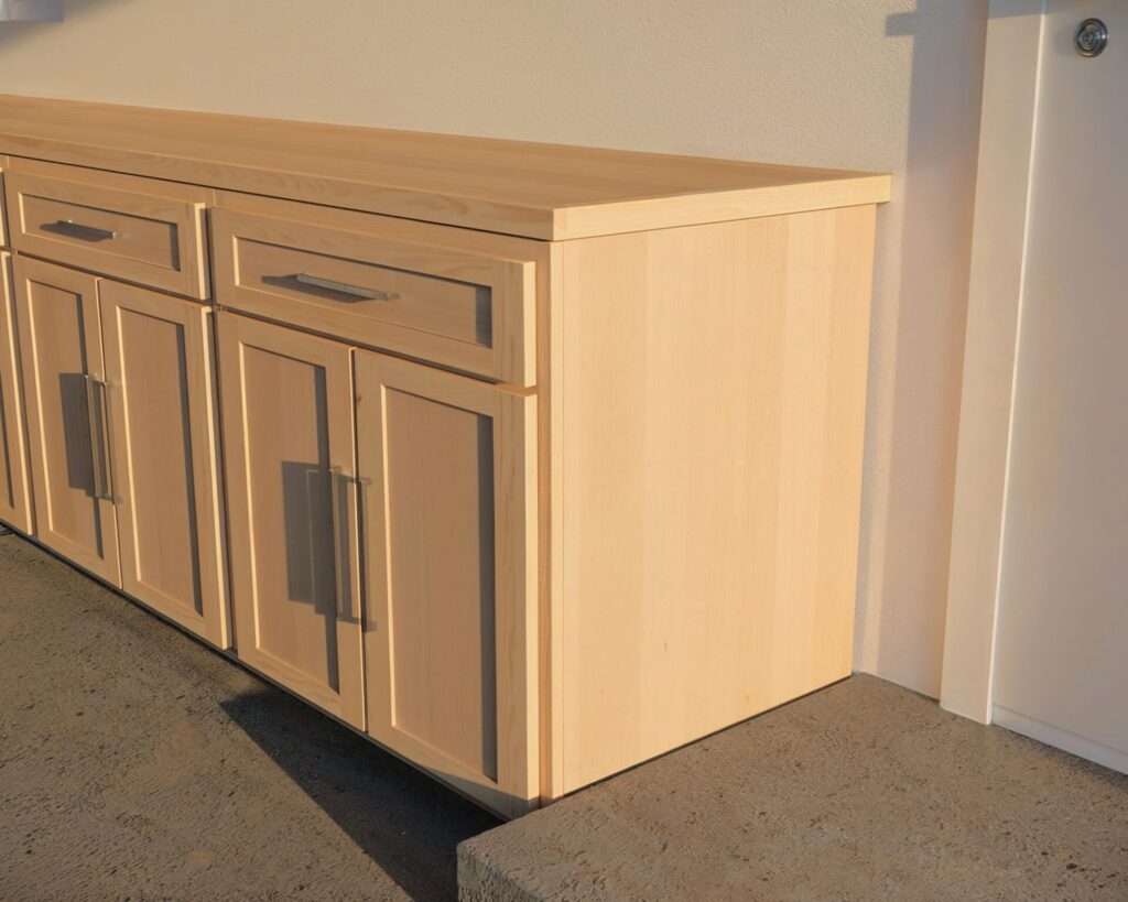 DIY cabinet counter made from 3/4 inch plywood with a wide top drawer and two cabinet doors, ideal for kitchen or garage setups.