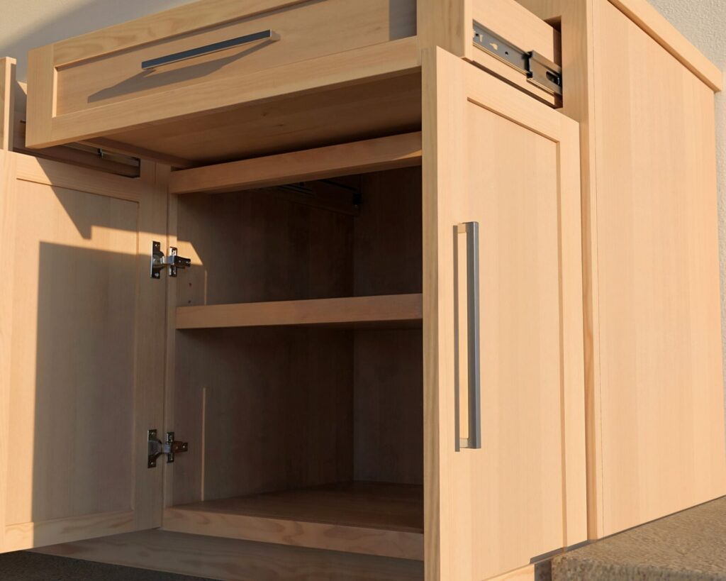 DIY cabinet counter made from 3/4 inch plywood with a wide top drawer and two cabinet doors, ideal for kitchen or garage setups.