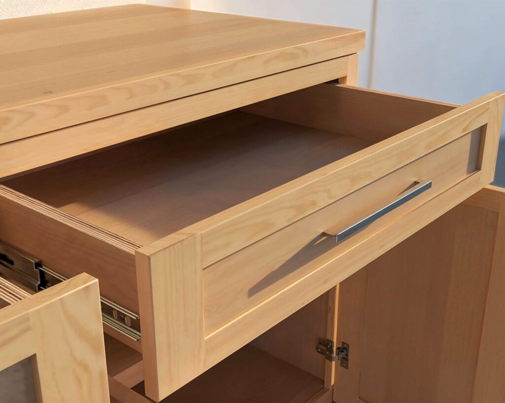 DIY cabinet counter made from 3/4 inch plywood with a wide top drawer and two cabinet doors, ideal for kitchen or garage setups.