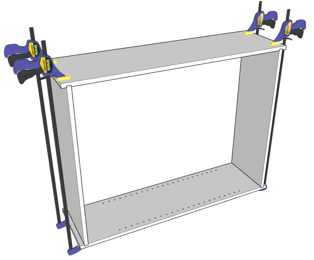 Using wood clamps to secure the cabinet carcass together