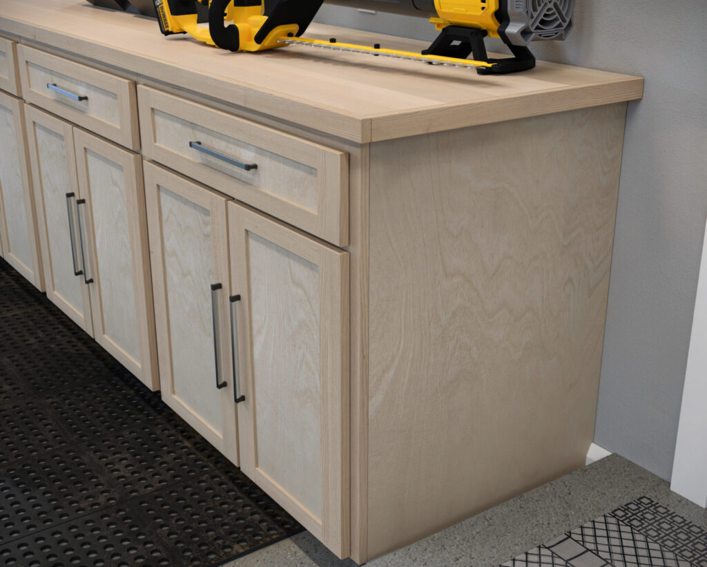 DIY garage wall and base cabinets designed for efficient storage, workspace organization, and tool accessibility.