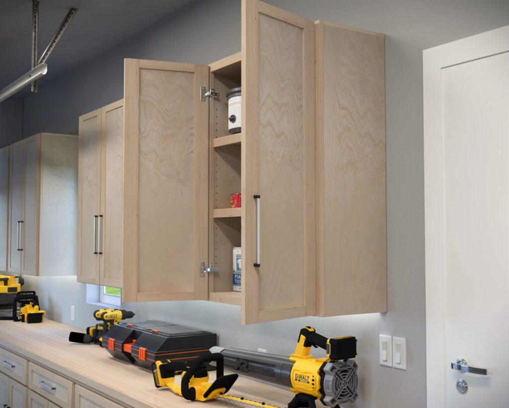 DIY garage wall and base cabinets designed for efficient storage, workspace organization, and tool accessibility.