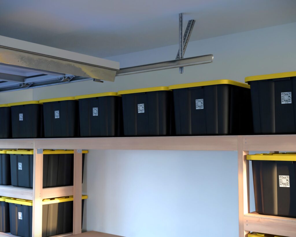 DIY garage shelving unit built with 2x4 lumber and plywood, designed to hold 27-gallon storage totes efficiently. The shelving features customizable configurations, making it a beginner-friendly and cost-effective storage solution for garages.