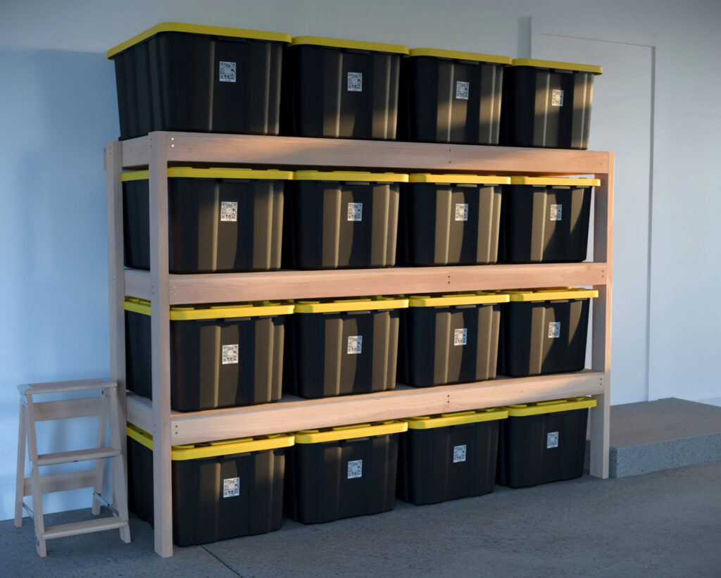 DIY garage shelving unit built with 2x4 lumber and plywood, designed to hold 27-gallon storage totes efficiently. The shelving features customizable configurations, making it a beginner-friendly and cost-effective storage solution for garages.