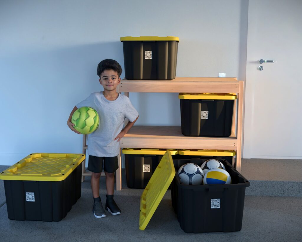 DIY garage shelving unit built with 2x4 lumber and plywood, designed to hold 27-gallon storage totes efficiently. The shelving features customizable configurations, making it a beginner-friendly and cost-effective storage solution for garages.