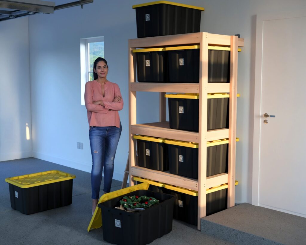 DIY garage shelving unit built with 2x4 lumber and plywood, designed to hold 27-gallon storage totes efficiently. The shelving features customizable configurations, making it a beginner-friendly and cost-effective storage solution for garages.