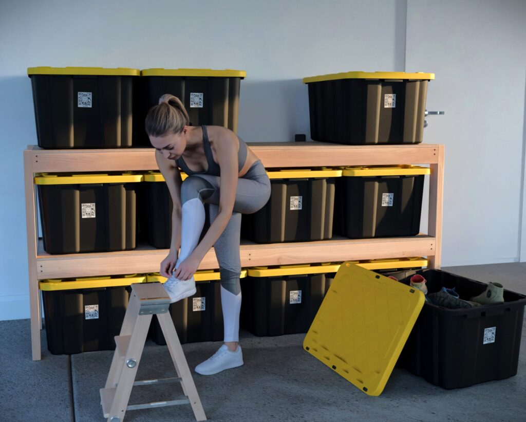 DIY garage shelving unit built with 2x4 lumber and plywood, designed to hold 27-gallon storage totes efficiently. The shelving features customizable configurations, making it a beginner-friendly and cost-effective storage solution for garages.